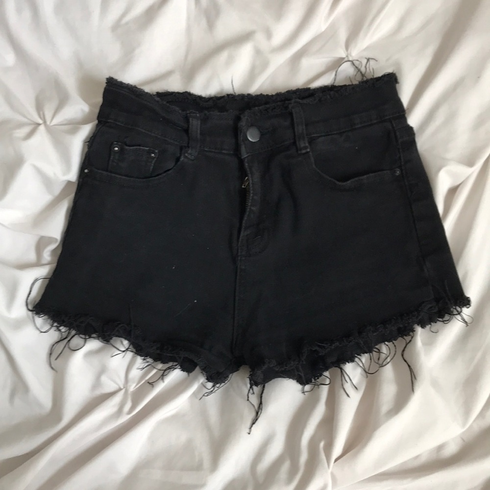 black shorts with rough, frayed edges